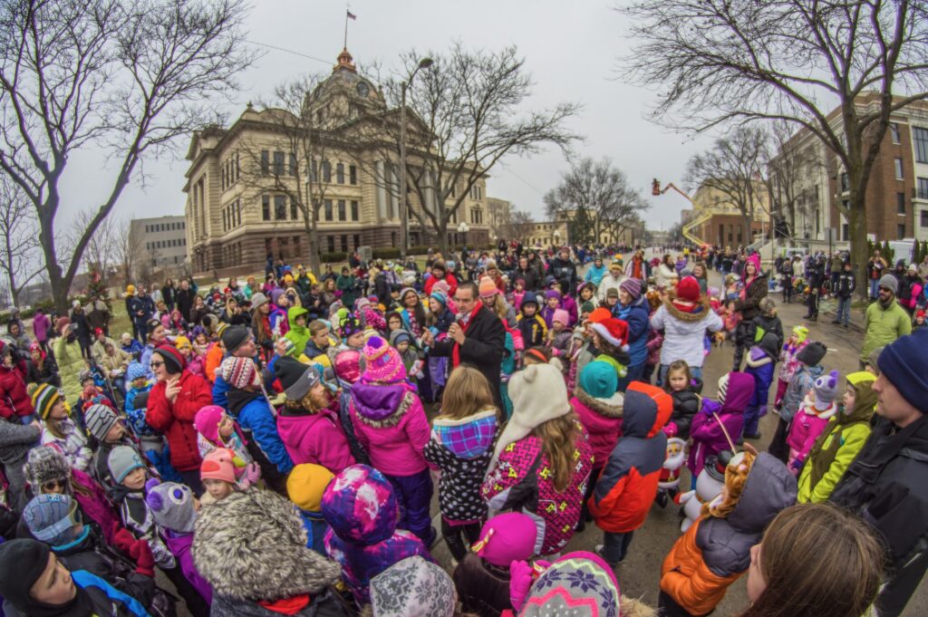 A large, diverse community crowd gathered outside Green Bay City Hall.