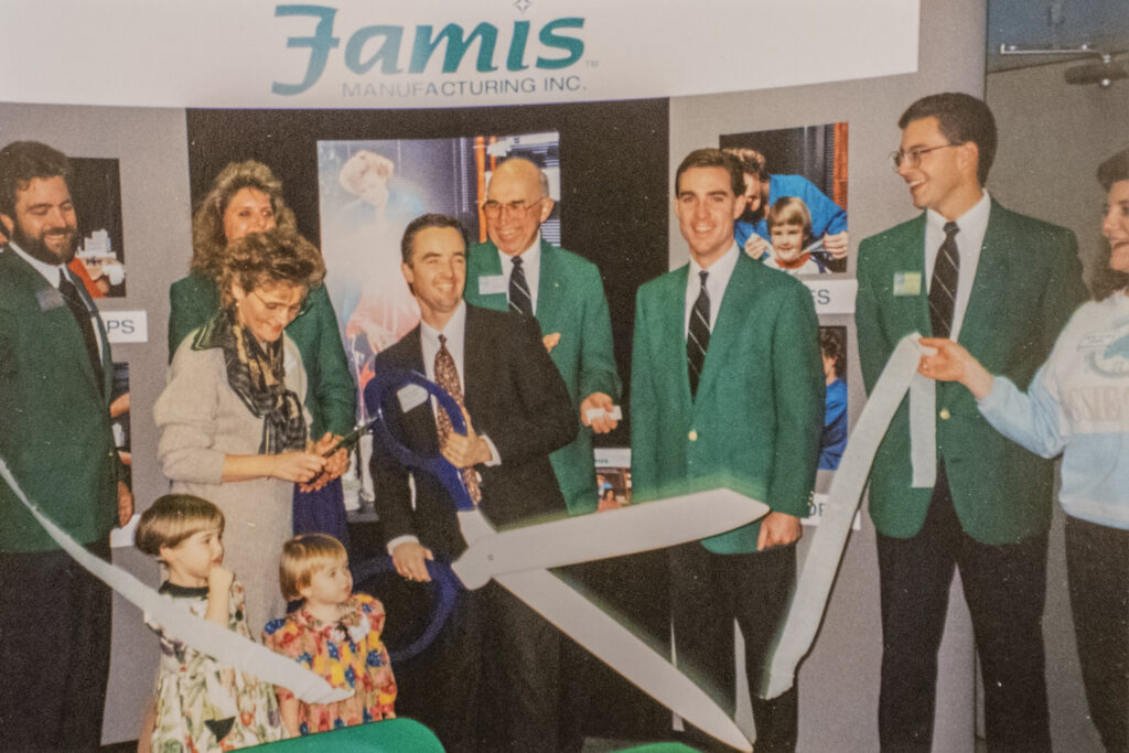 Jim Schmitt and colleagues at a Famis Manufacturing ribbon cutting in 1994.
